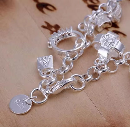 Elegant Silver Charm Bracelet with Crystal Accents Featuring Heart Cross Key Ring and Fashion Charms for Women