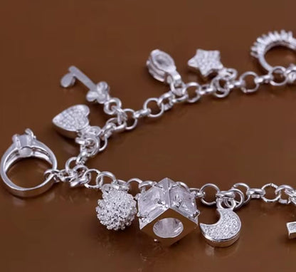 Elegant Silver Charm Bracelet with Crystal Accents Featuring Heart Cross Key Ring and Fashion Charms for Women