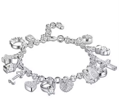 Elegant Silver Charm Bracelet with Crystal Accents Featuring Heart Cross Key Ring and Fashion Charms for Women